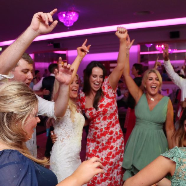 Joyful people dancing at a party- We do events