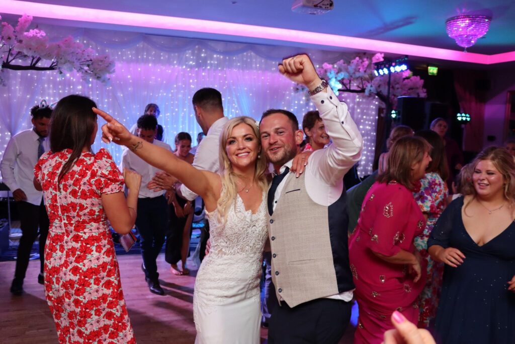 A couple dances at a wedding reception.