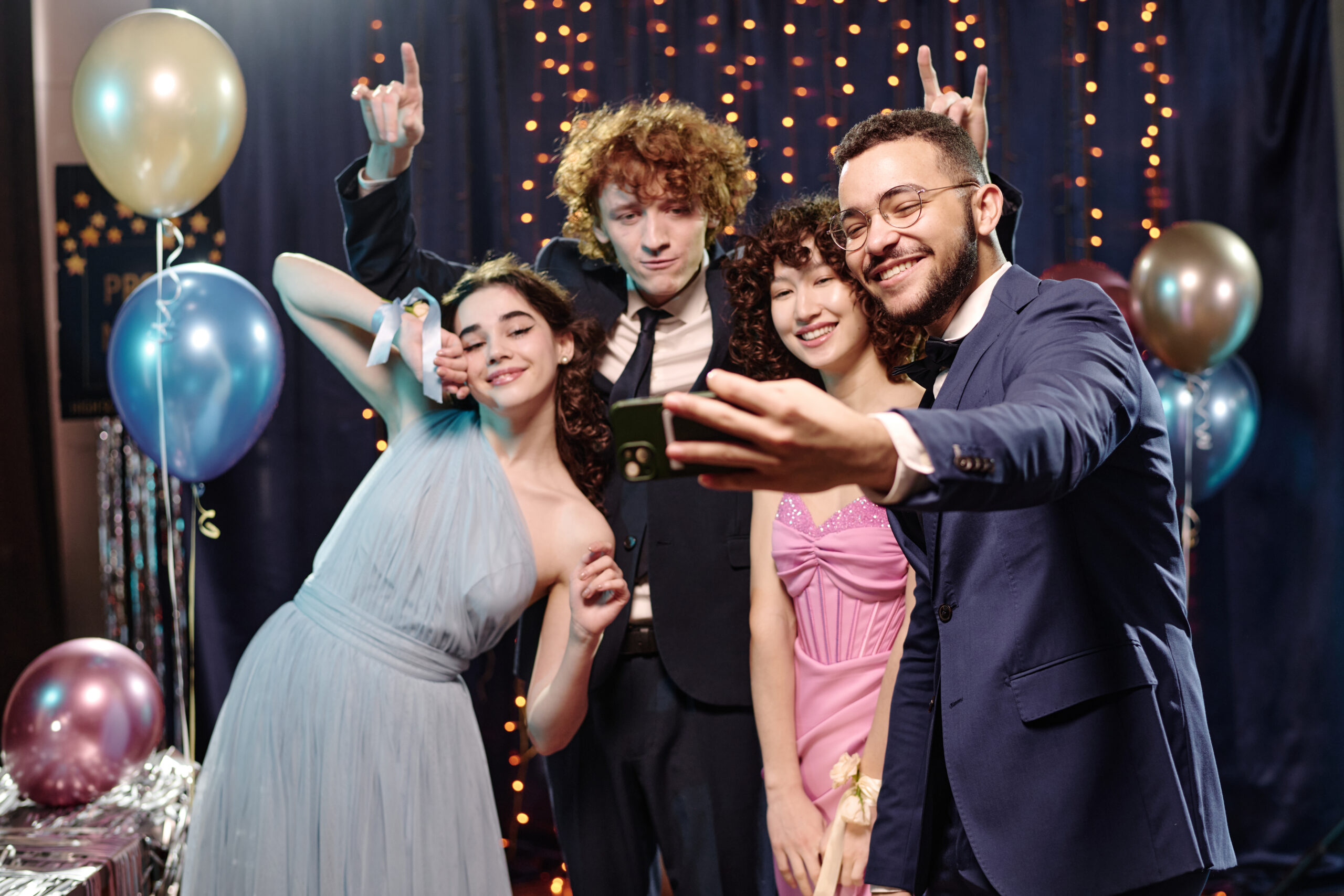 Group of teenagers taking a selfie at a party - We do events