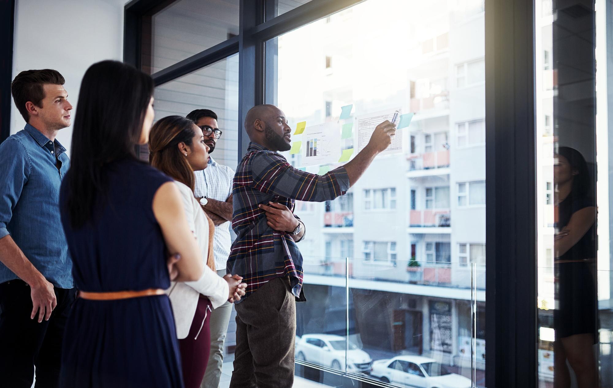 Business meeting at office with glass wall - We do events