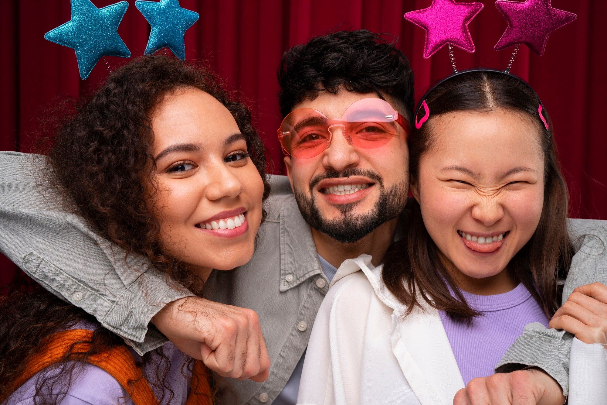 Three friends posing in a photo booth - We do events