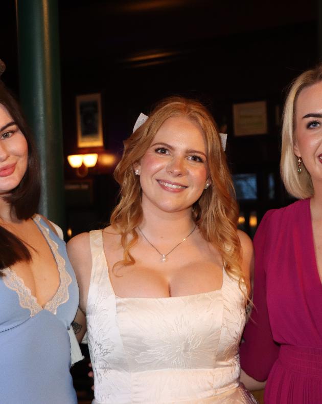 Wedding guests smiling together at a Galway wedding reception