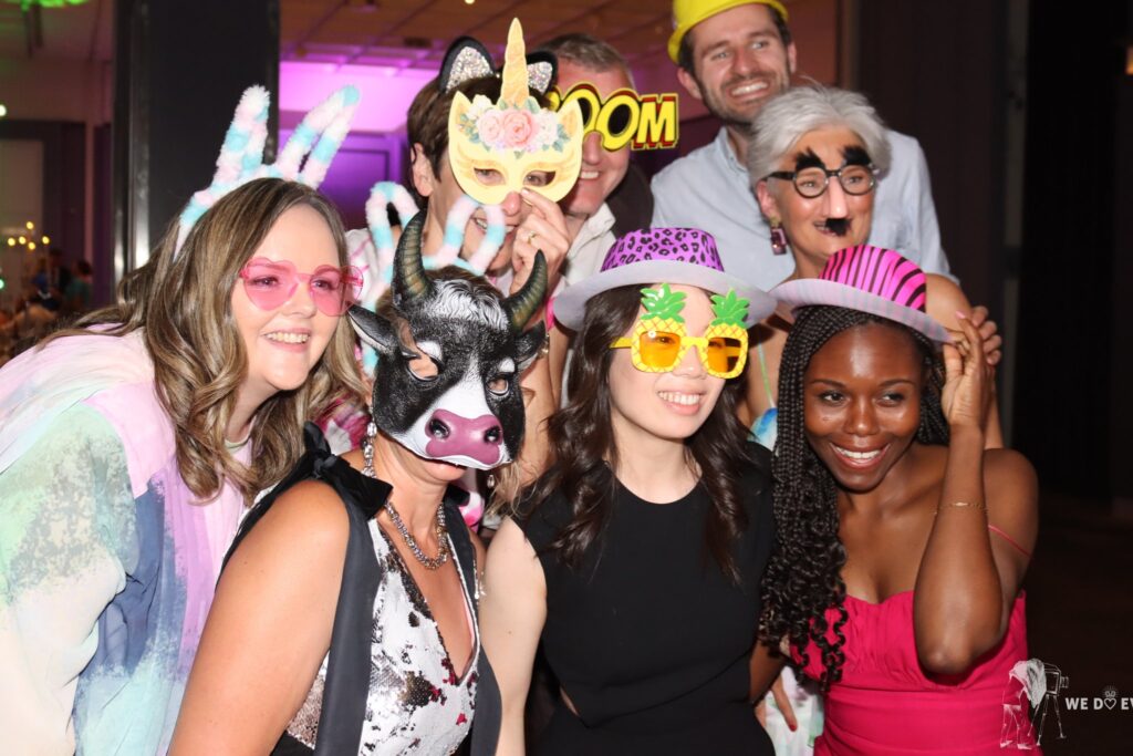 Group of guests posing with photo booth props and novelty glasses at the Galmont Hotel, Galway