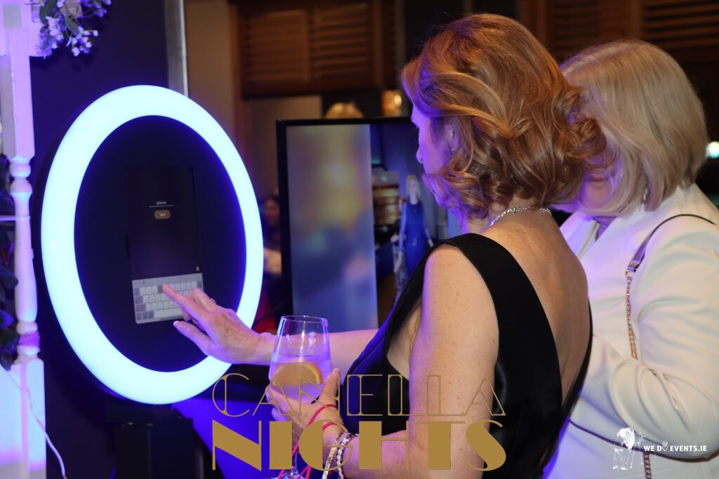 Guest using a ring-light selfie photo booth by We Do Events at Canella Nights, Galway