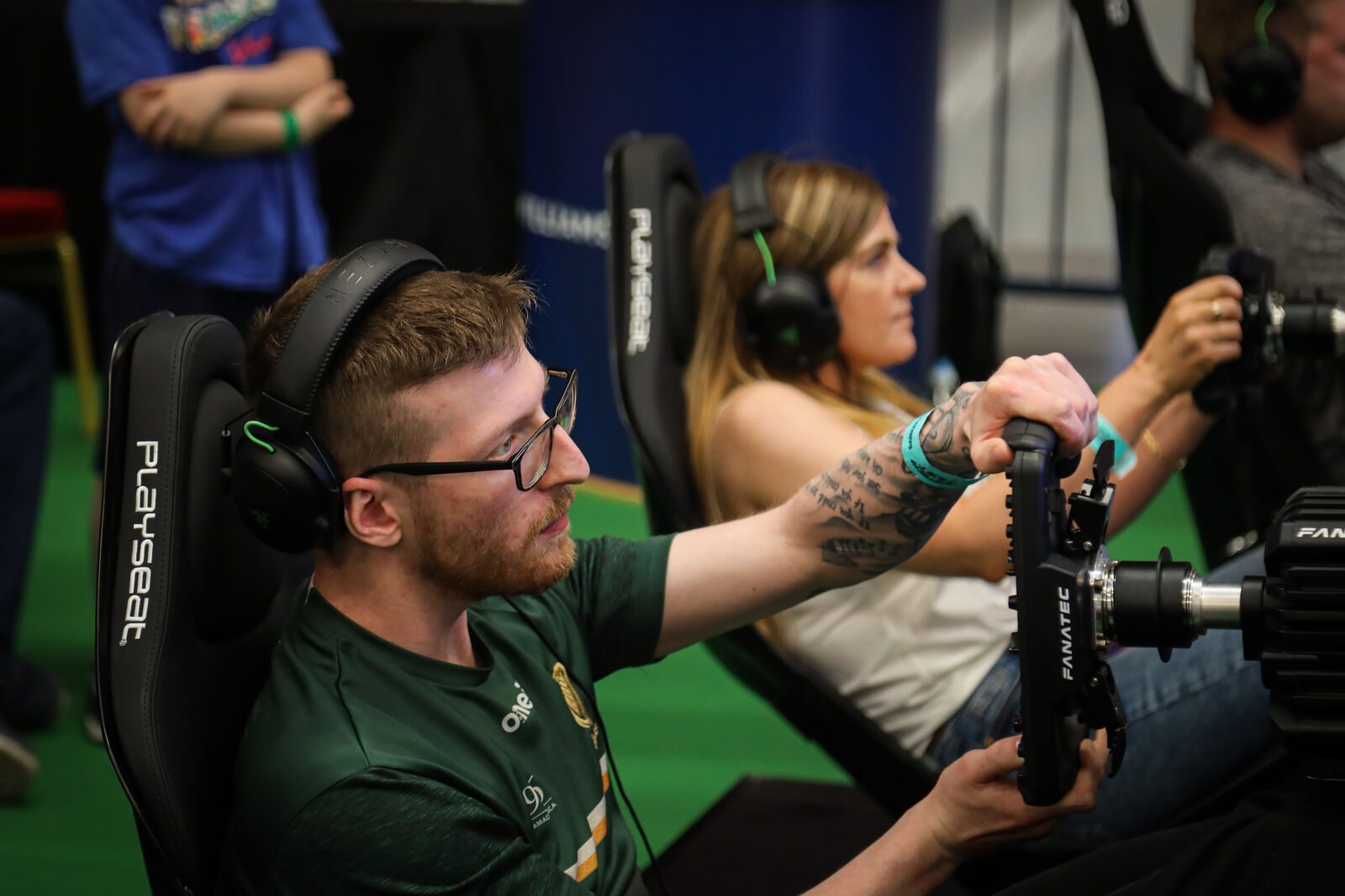 Guests racing on F1 simulators at a corporate event in Ireland